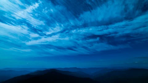 The cloud flow above mountains. evening night time Stock Footage 95189970