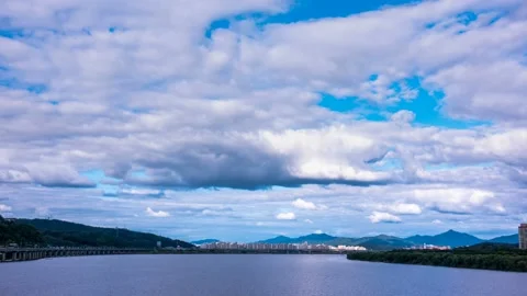 A cloud flowing smoothly along the riverside of Han River in Seoul. Video stock 145864208