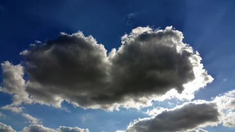 A cloud in the form of a heart on a blue sky Stock Photos