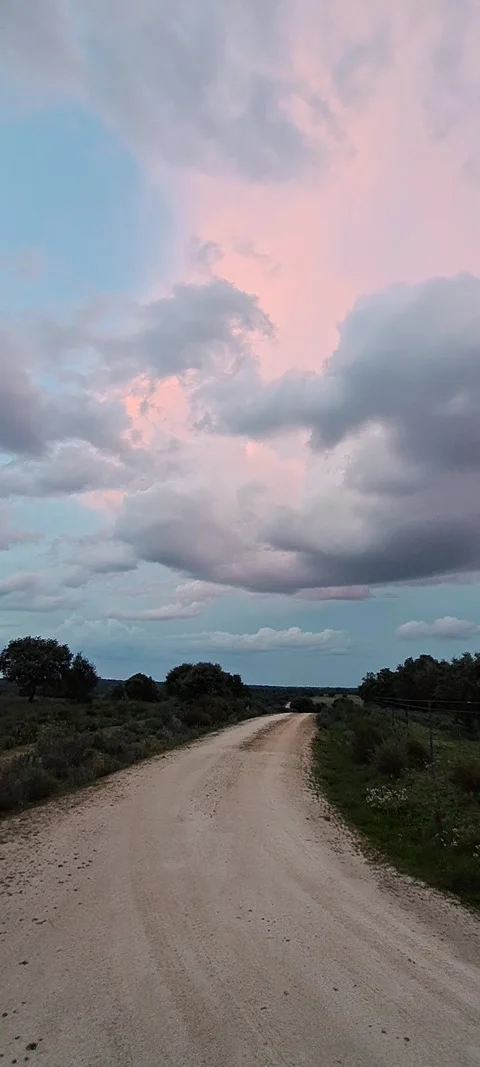 Cloud formation above a dusty road Stock Footage 315601766