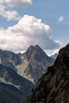 Cloud Formation Behind Mountain Peak Stock Photos