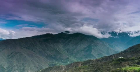 Cloud formation, mountains, greenery, trees, blue sky timelapse Видео 247133800
