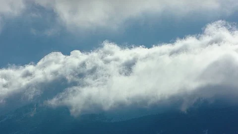 Cloud formation petting a mountain Stock Footage 83730470