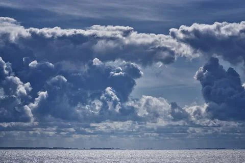 Cloud formation in the sky over the Baltic Sea. Stock Photos
