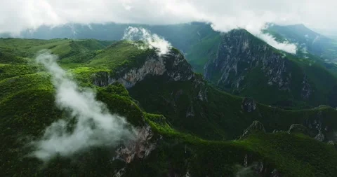 Cloud Formation Vaporization Moisture Vibrant Green Covered Mountain Range Video stock 300442687