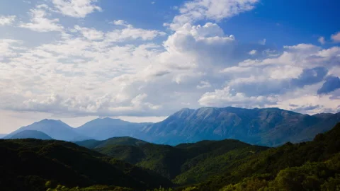 Cloud formations of a distant mountain range - 4K 30fps Stock Footage 322211549