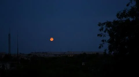 Cloud in front of the moon in the night sky Stock Photos