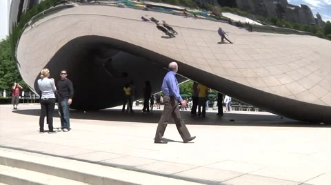 Cloud Gate at Millennium Park, Chicago, Bean- Man Walking Past Stock Footage 45321859