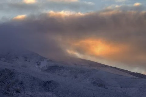 Cloud gilded by the light of the dawn Stock Photos