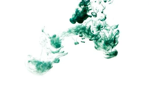 A cloud of green paint released into clear water. Isolate on a white backgrou Stock Photos