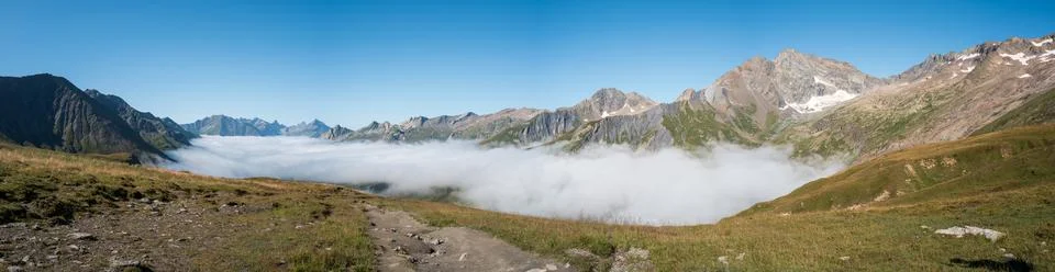 Cloud inversion over alpine valley panorama Stock Photos