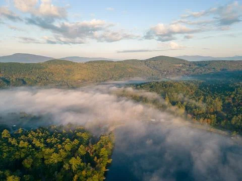 Cloud Inversion over Little Squam lake at sunrise in fall Stock Photos