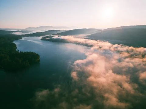 Cloud Inversion over Little Squam lake at sunrise in fall Stock Photos
