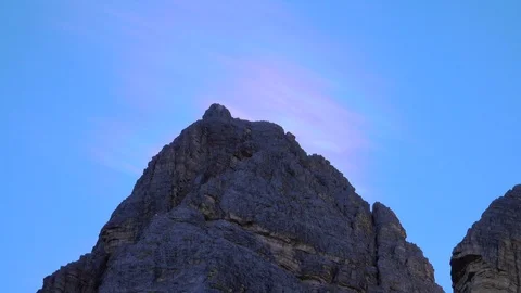 Cloud iridescence behind one of the three Peaks of Lavaredo Stock Footage 117230548