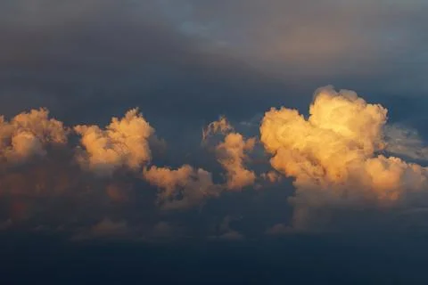 Cloud landscape of cumulus clouds with sunlight at dawn. Stock Photos