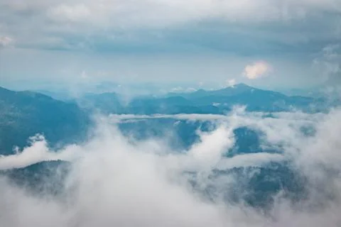 Cloud layers above mountain range 写真素材