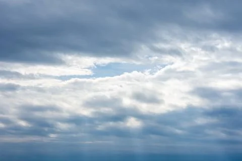 Cloud Layers with Blue Sky Opening – Natural Weather Scene. Stock Photos