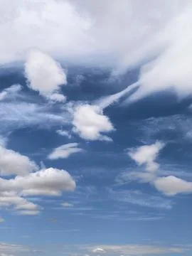 Cloud Layers Framing Deep Blue Summer Sky 写真素材