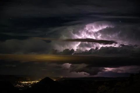 Cloud lighting in massive thunderstorm over small desert town Moab, Utah. Stock-Fotos