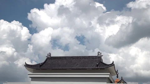 Cloud loop above Chinese Buddhist temple roof, time lapse in sunny day. Stock Footage 120156664