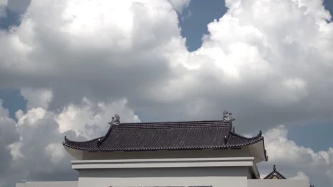 Cloud loop above Chinese Buddhist temple roof, time lapse in sunny day. Stock Footage 120160879