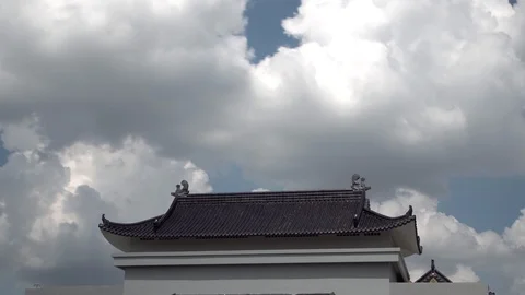 Cloud loop above Chinese Buddhist temple roof, time lapse in sunny day. Stock Footage 120161859