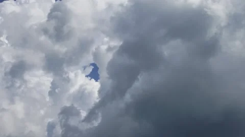 Cloud mass covering blue sky patch in natural motion. Stock Footage 337048124