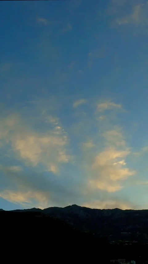 Cloud move fast over mountain in blue sky time lapse Stock Footage 340537473