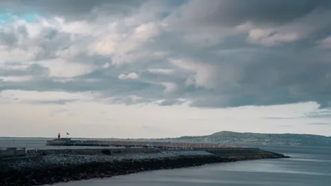 Cloud movement over Dun Laoghaire pier, Ireland 4k timelapse Stock Footage 346263775