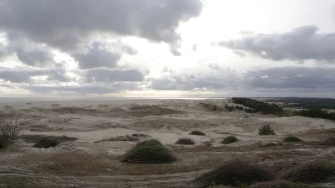 Cloud movement over dunes Stock Footage