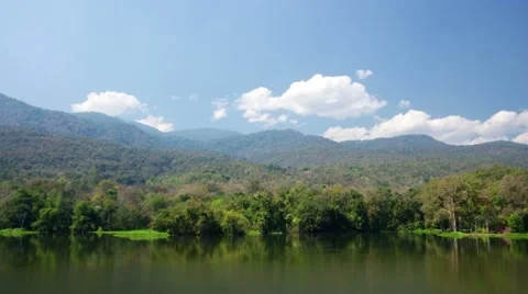 Cloud movement over mountain range and reservoir Stock Footage 47866232