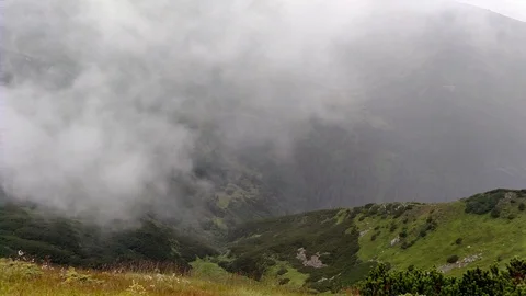 Cloud movement in rain Mountain ranges in cloudy weather near lake Stock Footage 116718375