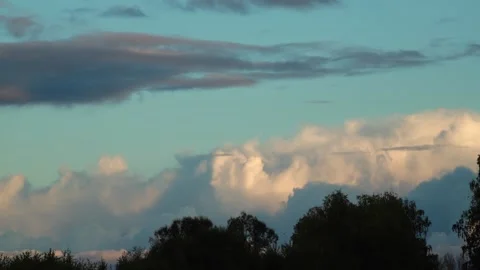 Cloud movement in timelapse over crones trees in the summer evening. Stock Footage 257513101