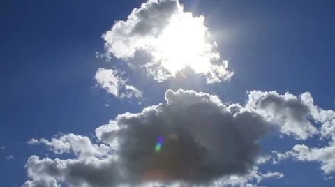 Cloud moves past sun revealing it Stock Footage 10568495