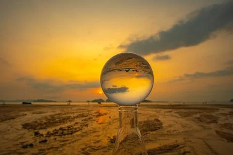 Cloud moving in beautiful sunset inside crystal ball. 스톡 사진