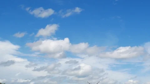 Cloud moving on blue background timelapse seen. Stock Footage 79672416