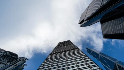 Cloud moving over sky scrapers time lapse Stock Footage 107091412