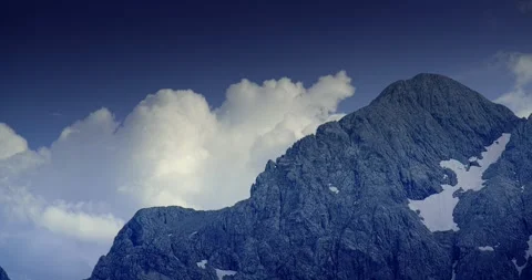 Cloud Over an Alpine Peak Stock Footage 284817461