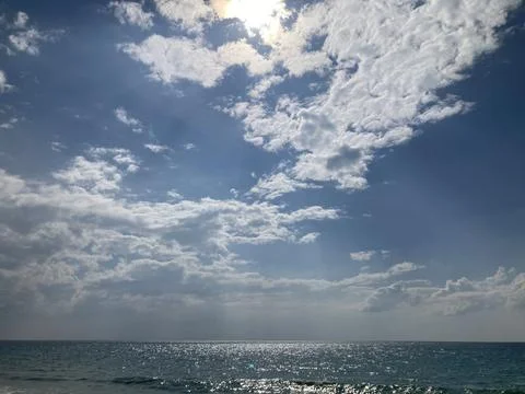 Cloud over the bright dark blue sea Stock Photos