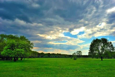 Cloud over the green meadow 스톡 사진