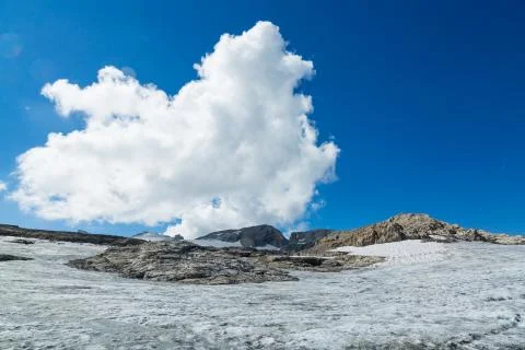 Cloud over the top of Alps and glacier Stock Photos