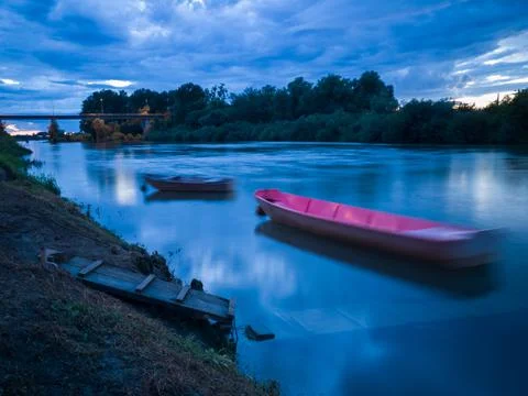 Cloud overcast evening during blue hour. Landscape with Sava river Stock Photos