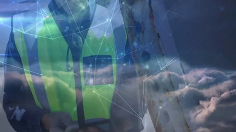 Cloud overlay appearing, worker fading, inspecting rusted ladder, tapping tablet Stock Footage 332428720