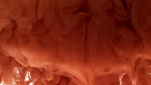 Cloud of pale orange paint Video stock 165666618