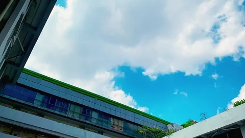 Cloud pass over top of apartment building Stock Footage 330571981