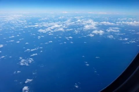 Cloud pattern between sea below and sky above Stock Photos