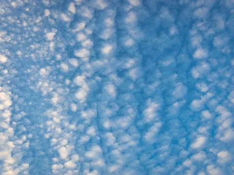 Cloud pattern of dotted altocumulus clouds, high up in the sky Stock Photos
