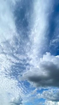 Cloud patterns and blue sky during daylight hours above an open field creat.. Stock Photos