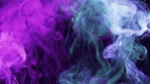A cloud of pink and blue particles moving on black background. Video stock 134569817