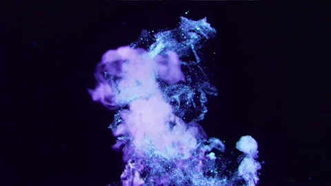 A cloud of pink and blue particles moving on black background. Vídeo Stock 134573845
